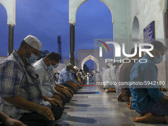 Muslims perform prayers with no social distancing at the Baitul Mukarram National Mosque during coronavirus in Dhaka Bangladesh on August 22...
