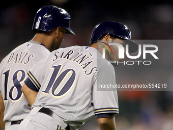 Milwaukee Brewers Luis Sardinas #10 scores a run on a single hit by Carlos Gomez during the seventh inning of a baseball game against the De...