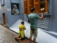 Devotees offer  prayers from outside to the tomb of Saint Teresa . This year marked the 110th year Birthday of Saint Teresa of Kolkata. The...