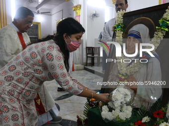 People pray at St. Thomas Church in Kolkata on August 26, 2020 during the 110th birth anniversary of Mother Teresa.   (