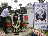 Social activists put face Mask on the statue Mother Teresa to create awareness COVID-19 on her 110th birth anniversary in Kolkata,India on A...