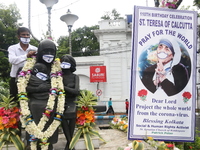 Social activists put face Mask on the statue Mother Teresa to create awareness COVID-19 on her 110th birth anniversary in Kolkata,India on A...