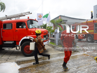 Firefighters try to put out a fire at Access Bank branch on Adetokunbo Ademola Street in Victoria Island in Lagos on August 26, 2020.   (