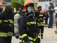 A firefighters at the scene of Access Bank branch fire out break on Adetokunbo Ademola Street in Victoria Island in Lagos on August 26, 2020...