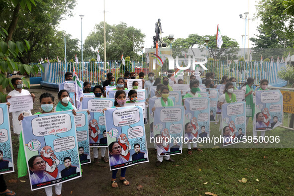 Students and Member of Trinamool Congress Chharta Parisad (TMCP) holds posters during a protest against the Union Government conducting JEE...