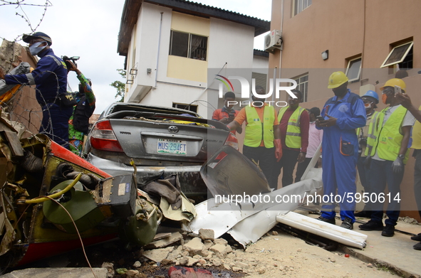 Officers and rescue teams amidst debris after a Quorom helicopter crash, a helicopter operated by Quorom Aviation which crashed in 16A Salva...