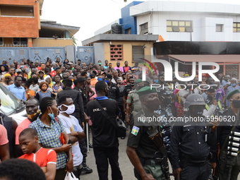 Officers and crowds gather at the scene after a Quorom helicopter crash, a helicopter operated by Quorom Aviation which crashed in 16A Salva...