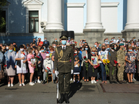 Honor Guard soldier stand next to fallen heroes families during the commemorative ceremony at the territory of Defence Ministry in Kyiv, Ukr...