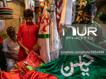 People buy traditional cloths embroidered with urdu or arabic words in the local shop inside the geneva camp  in Dhaka, Bangladesh, on Augus...