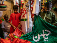 People buy traditional cloths embroidered with urdu or arabic words in the local shop inside the geneva camp  in Dhaka, Bangladesh, on Augus...