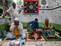 People pray and recite holy quran to celebrate ashura in Dhaka, Bangladesh, on August 29, 2020. (