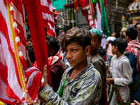 Young Bihari men carry flying banners in a procession in Dhaka, Bangladesh, on August 29, 2020 (