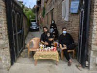 A Kashmiri shite family distribute juice to the mourners on 10th of Muharram in Srinagar, Indian Administered Kashmir on 30 August 2020. Aut...