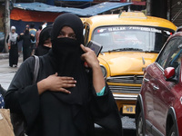 A Woman of Shiite Muslim reacts during the Muharram procession in Kolkata, India, on August 29, 2020. Muharram is a month of mourning in rem...