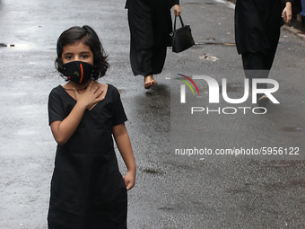 A Girl  of Shiite Muslim warring face Mask  and maintain social distances  during the   Muharram procession in Kolkata, India, on August 29,...