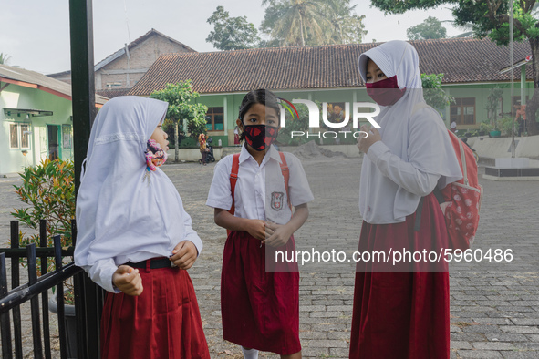 Students gather before entering the classroom at Candirejo Elementary School, Semarang Regency, Central Java, Indonesia, on September 1, 202...