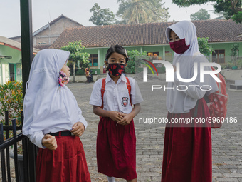 Students gather before entering the classroom at Candirejo Elementary School, Semarang Regency, Central Java, Indonesia, on September 1, 202...
