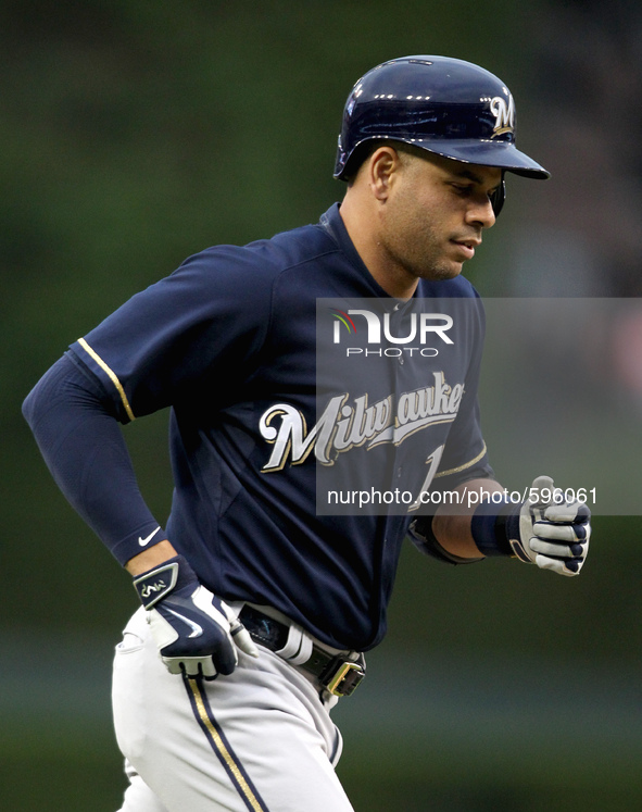 Milwaukee Brewers' Aramis Ramirez round the bases after his solo home run in the third inning of a baseball game against the Detroit Tigers...