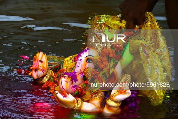 A Hindu Devotees immerse idols of the Hindu elephant god Ganesh during the Ganesh Chaturthi festival in Ajmer, Rajasthan, India on 01 Septem...