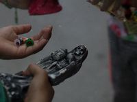 Devotees to Santa Muerte attend her altar in the Bravo neighborhood of Tepito with her image of different sizes to give thanks. On 1st Septe...