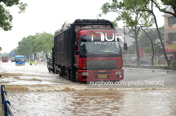GUILIN, May 20, 2015 () -- A truck moves on a flooded street in Guilin, south China's Guangxi Zhuang Autonomous Region, May 20, 2015. As hea...