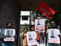 Students hold party banner and posters of Gauri Lankesh in front of Jadavpur University in Kolkata, India, on September 5, 2020 during third...