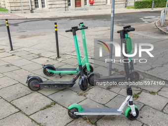 Bolt and Lime electric kick scooters standing at the pavement are  seen in Gdansk, Poland on 5 September 2020  (