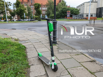 Lime electric kick scooter standing at the pavement is  seen in Gdansk, Poland on 5 September 2020  (