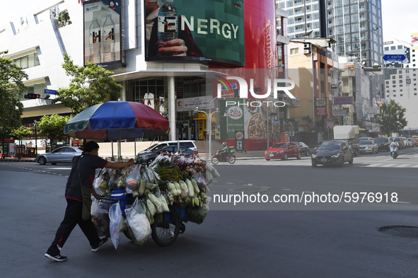 A Thai street food vendor pushes cart loaded in Bangkok, Thailand, on September 06, 2020. 