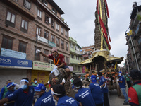 Nepalese devotees along with the face mask and shield pulling the chariot of Lord Minnath at Pulchowk, Lalitpur, Nepal on Sunday, September...
