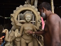 An artist is sculpting the Vishwakarma idol with clay ahead of Vishwakarma Puja in Nagaon District of Assam, India , on September 07, 2020....
