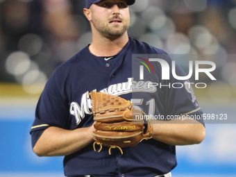 Milwaukee Brewers pitcher Jonathan Broxton reacts after giving up 3-runs in the eighth inning  against the Detroit Tigers in Detroit, Michig...