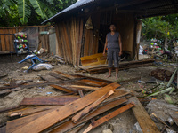 A mother is inside her house which was damaged by the flood in Oloboju Village, Sigi Regency, Central Sulawesi Province, Indonesia on 9 Sept...