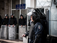Anti riot cops are standing in front of regional building in Donetsk to protect it against attacks, on March 20, 2014. (