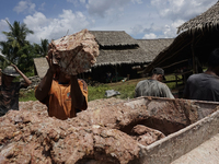 Workers making bricks in Palembang, South Sumatra, Indonesia on June 30, 2020, then using machines. Sales of bricks in Palembang have droppe...