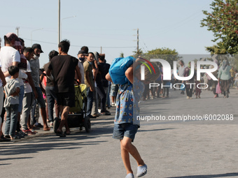 Refugees queue for Food distribution in Lesbos on September 14, 2020 (