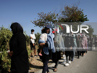 Refugees queue for Food distribution in Lesbos on September 14, 2020 (