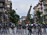 Nepalese Armed Police Force guard around idol Rato Machindranath on a last day at Pulchowk, Lalitpur, Nepal on Monday, September 14, 2020. T...