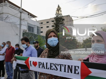 Palestinians protest in Gaza City against the United Arab Emirates and Bahrain normalization agreements with Israel, in front of the office...
