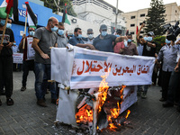 Palestinians protest in Gaza City against the United Arab Emirates and Bahrain normalization agreements with Israel, in front of the office...