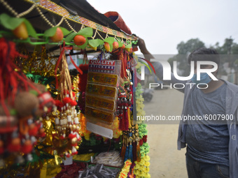 A seller selling decorating materials for the Vishwakarma Puja at Lalitpur, Nepal on Wednesday, September 16, 2020. Vishwakarma is the deity...