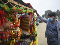 A seller selling decorating materials for the Vishwakarma Puja at Lalitpur, Nepal on Wednesday, September 16, 2020. Vishwakarma is the deity...