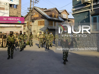 Indian forces arrive at an encounter site in Batamaloo area of Srinagar, Indian Administered Kashmir on 17 September 2020. Three Kashmiri mi...