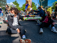 Some climate activists blocked the main road of the financial district by chained themselves during an act of peaceful civil disobedience. W...