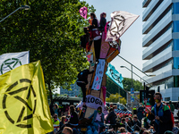 Climate activists blocked the main road of the financial district during an act of peaceful civil disobedience. With these actions, XR deman...