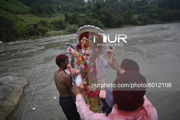Nepalese Devotees carrying the idol of lord Vishwakarma to immerse in the Bagmati river at Kathmandu, Nepal Friday, September 18, 2020. Vish...