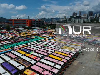 In this photo taken on September 7, 2020 shows an Aerial Photograph of a parked tour buses parked in a parking lot in Hong Kong, China.  (