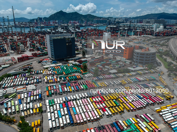 In this photo taken on September 7, 2020 shows an Aerial Photograph of a parked tour buses parked in a parking lot in Hong Kong, China.  