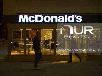 People walk by a McDonald's restaurant on September 18, 2020 in Warsaw, Poland. (