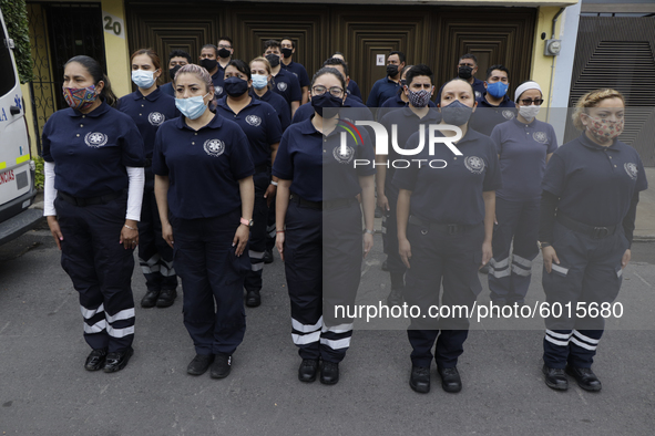 Rescuers and paramedics stood guard outside the Rébsamen School in Mexico City, in memory of the children who died after a building collapse...